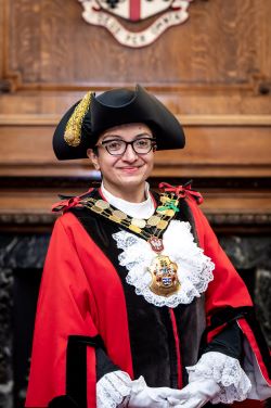 Photo of Mayor Cllr Khurana in black and red mayoral clothes