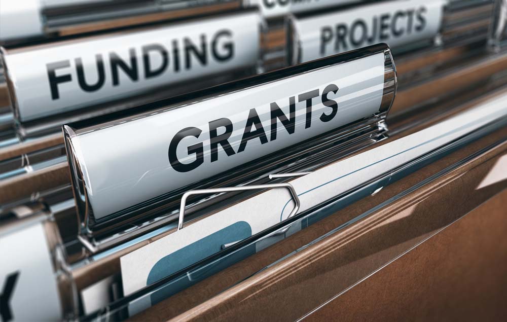 File folders reading Funding and Grants